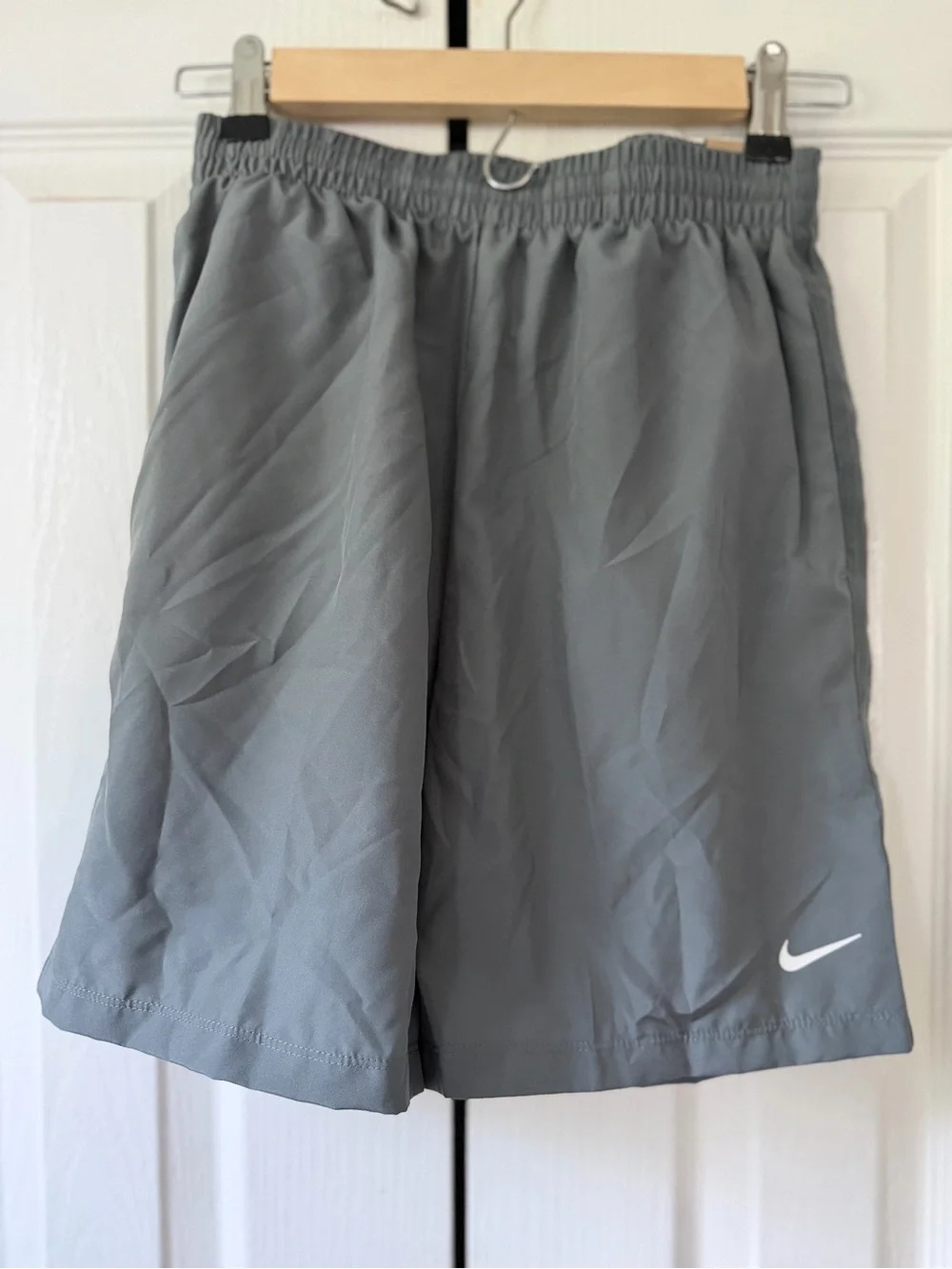 Nike Gray Athletic Shorts with White Swoosh